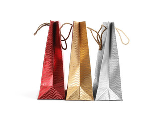 Color paper shopping bags isolated on white