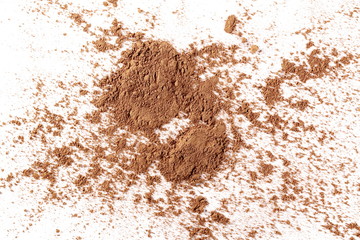 Cocoa powder pile isolated on white background, top view