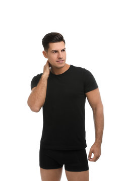 Handsome Man In Black Underwear And T-shirt On White Background