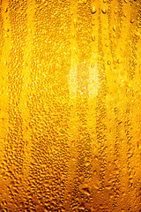 A foggy window at sunset as an abstract background