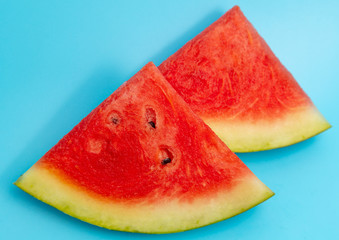 Ripe red watermelon isolated on a blue background