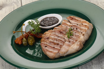 Grilled pork steak with pepper sauce