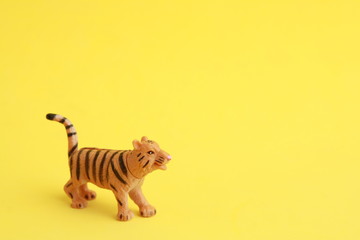 Fototapeta na wymiar tiger toy in color background