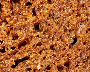 Black rye bread as an abstract background