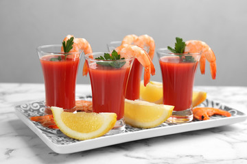 Shrimp cocktail with tomato sauce served on marble table