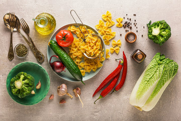 Vegetarian background. Vegetarian food menu. Ingredients vegetable salad and a side dish of pasta.