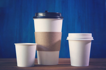 empty cardboard Cup on wooden background