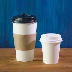 empty cardboard Cup on wooden background