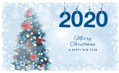Gift card. Christmas Tree unfocused, blurred colored lights on the blue background with snowflakes, with a Merry Christmas Message.  Postcard.