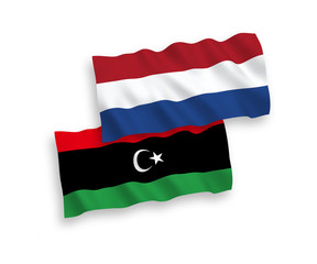 Flags of Libya and Netherlands on a white background