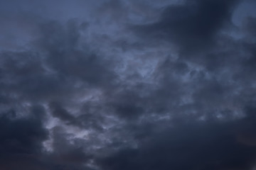 Naklejka na ściany i meble The sky before the rain, the cloudy dramatic sky, dark clouds texture background