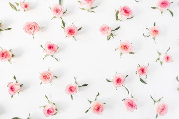 Round frame border of pink rose flower buds on white background. Mockup blank copy space. Flat lay, top view floral composition.