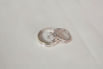 Cluster stack of diamond wedding engagement rings isolated on white . Beautiful jewelry rings .