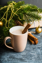 Cup of hot chocolate with christmas decorations on the rustic background. Selective focus. Shallow depth of field.