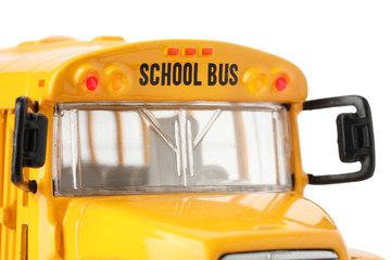 Yellow school bus on white background, closeup. Transport for students