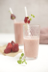 Milk and fruit cocktail from strawberries in a glass.