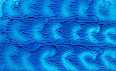 Abstract classic blue acrylic pattern. Trendy textured background of different blue and green colors. Pattern created as the surface of the Earth from space. Color of the year 2020,