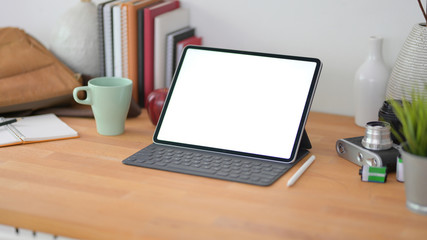 Cropped shot of comfortable office room with blank screen digital tablet