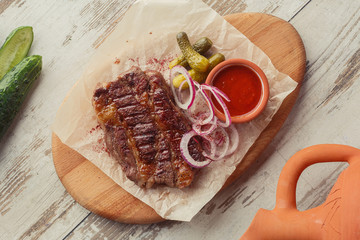 Georgian dish on the table photo for the menu of Eastern Caucasian cuisine. Beef steak.