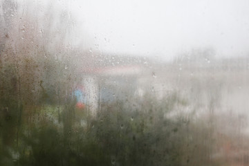 Rain drops on window spring rainy day