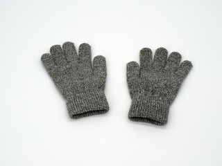 Gray children's gloves. For boys and girls. Left and right on a white background.  Selective focus