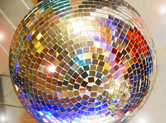 festive multi-colored shiny ball with mosaic from pieces of a mirror