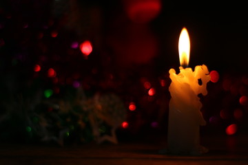 Background with candle and christmas ornaments