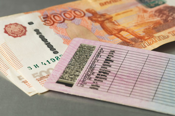 driver's license and cash, close-up