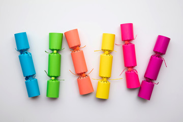 Bright colourful hristmas crackers on a plain background. festive layflat