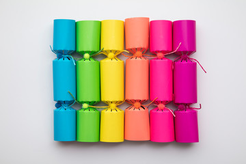 Bright colourful hristmas crackers on a plain background. festive layflat