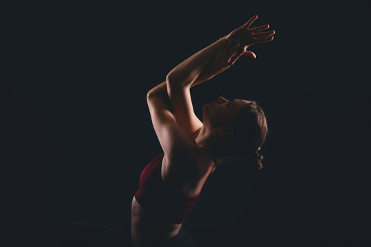 Close up photo of woman doing yoga, garudasana eagle arms