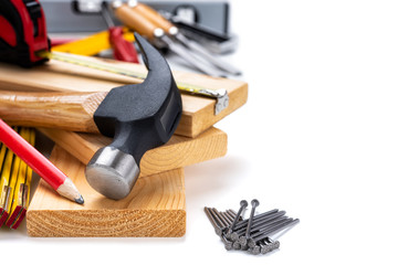 Close-up of hammer and carpenter's tools on a white background. Construction industry, do it yourself. Text space.