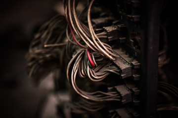 Electric wiring from back view of old car engine control unit ,selective focus vintage style
