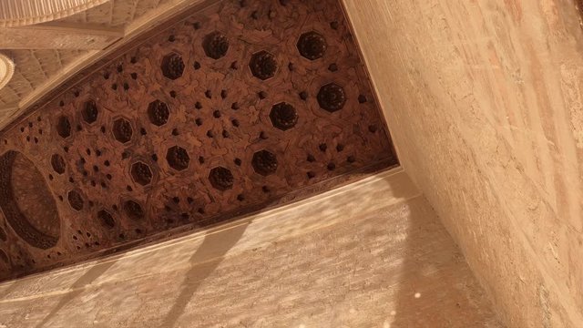 Water reflections of the fountain on the walls and ceilings of the Partal viewpoint in the Alhambra. Granada, Andalusia, Spain.