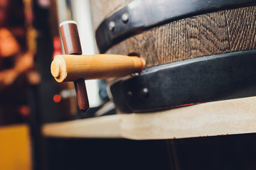 Detail of a wooden wine barrel. The barrel clogged it with a stopper and burlap. Vintage look.
