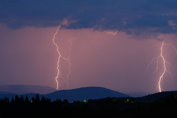 Fototapeta na wymiar Thunderstorm with lightning on the mountain.