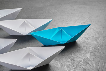Business Concept, Paper Boat, the key opinion Leader, the concept of influence.