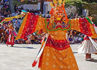 Masked dancers performing at Mongar festival in Eastern Bhutan 