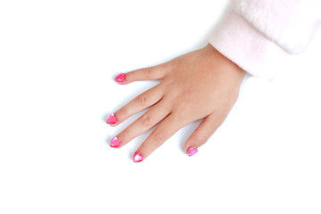 Children nails with fashion jewels isolated on cyan background. Close up shot.