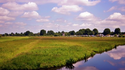 Naklejka premium landscape with river and blue sky