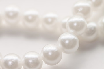 Fototapeta na wymiar Pearl beads nacrous string jewelry isolated white background