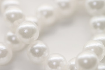 Pearl beads string jewelry isolated white background macro