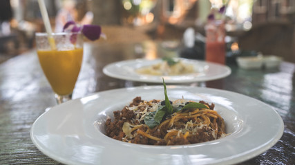 A dish of a pasta with seafood in a red sauce. Close up.