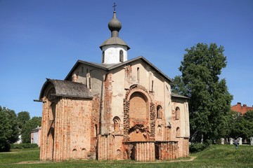 Fototapeta na wymiar Veliky Novgorod, Russia, May 2018. An old brick Orthodox church under restoration.