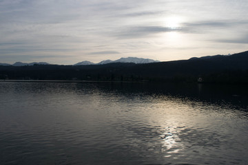 Fototapeta na wymiar Sunset over a lake with calm waters