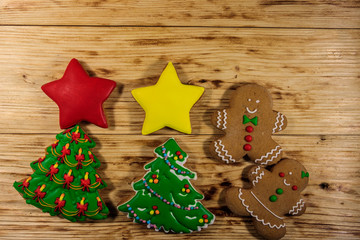 Tasty festive Christmas gingerbread cookies on wooden table. Top view