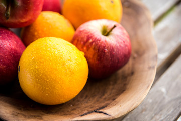Naklejka na ściany i meble fresh fruits in a bowl closeup