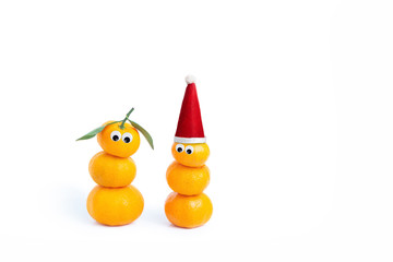 Cheerful tangerine figurine on a white isolated background. Santa claus from tangerines. Snow woman.