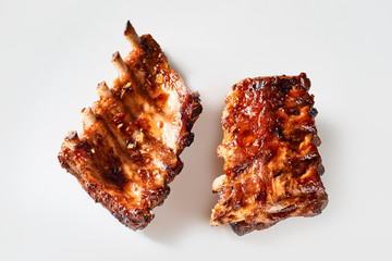 Studio shot of portions of grilled marinated ribs