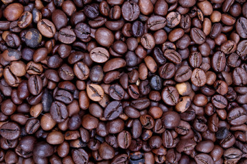 coffee beans with burlap sack on wooden background